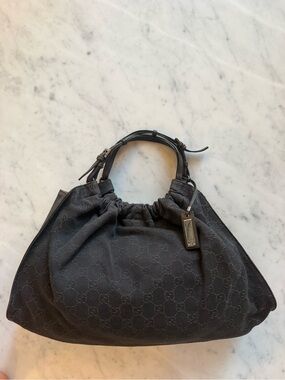 Slightly worn Vintage Authentic Gucci Black GG Drawstring Shoulder Bag